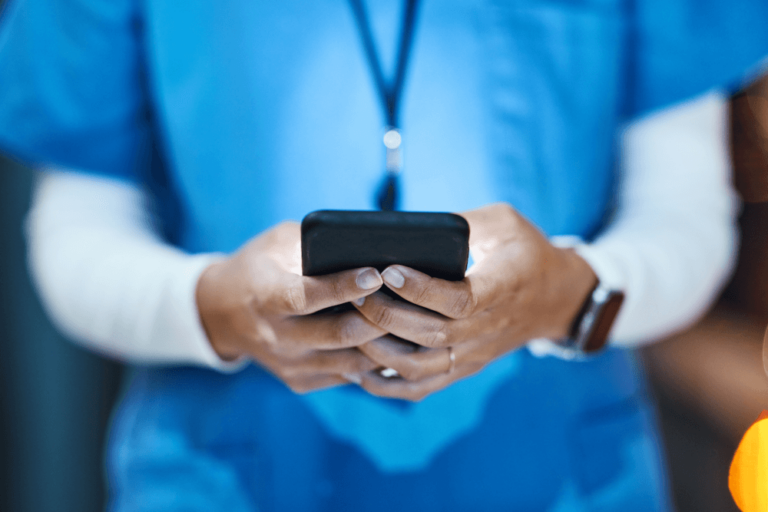 Doctor holding mobile phone © C Malambo/peopleimages.com/stock.adobe.com