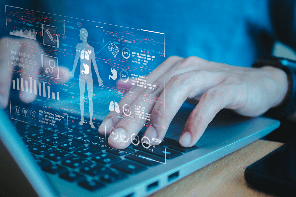 Person on laptop with medical imagery overlaid © woravut/stock.adobe.com