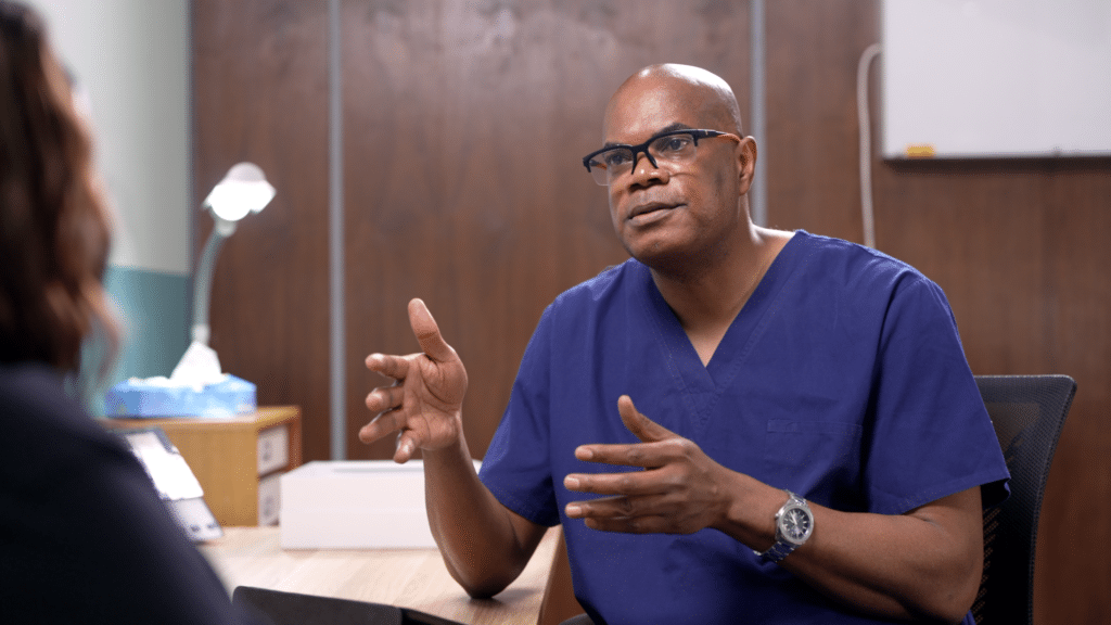 Prof. Seidu in conversation with patient Margaret.